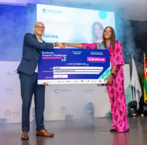 Ecobanks-Group-CEO-Jeremy-Awori-hands-over-the-grand-prize-of-US50000-to-winner-Koree-from-Cameroon